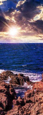 Sunset with cliff rocks and sea