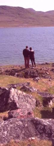 Couple standing looking at a Fjord