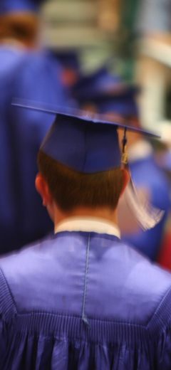 student in graduation robes