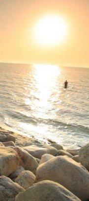 sunrise with beach rocks