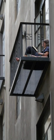 student studying on balcony