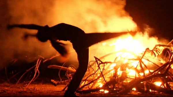 Contemporary dancer in front of fire