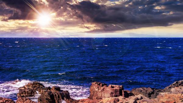 Sunset with cliff rocks and sea