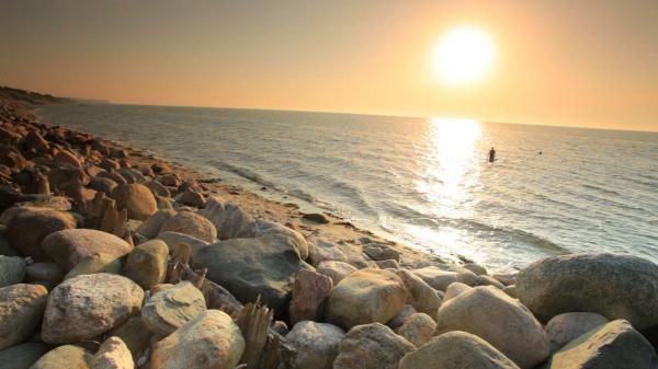 sunrise with beach rocks