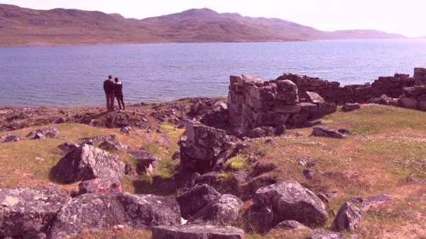 Couple standing looking at a Fjord