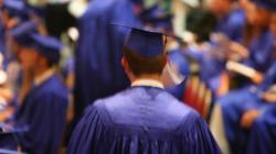 Student in Blue Graduation Robes